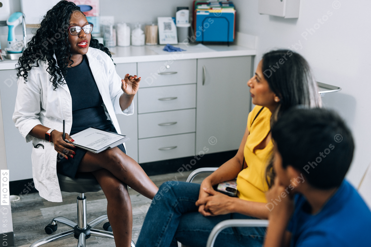 Mother and son talking with doctor