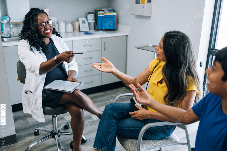 Mother and son talking with doctor