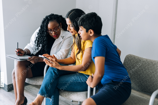Black prediatric doctor consulting Indian patients