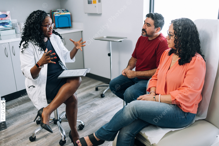 Black family medicine doctor consulting Hispanic patients