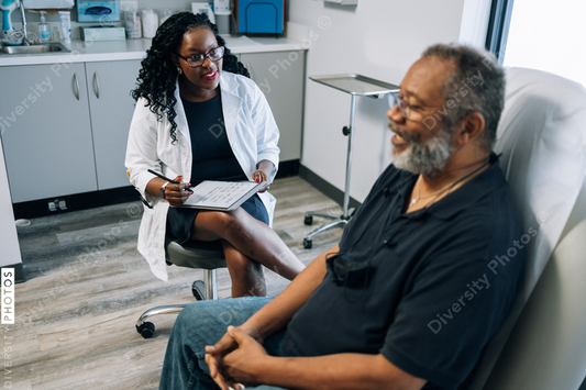 Doctor consulting African American man