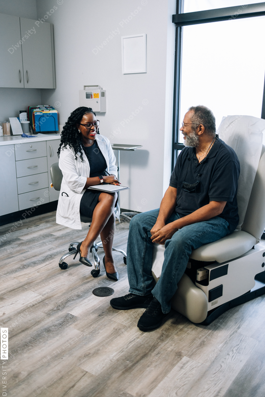 Black doctor consulting male patient