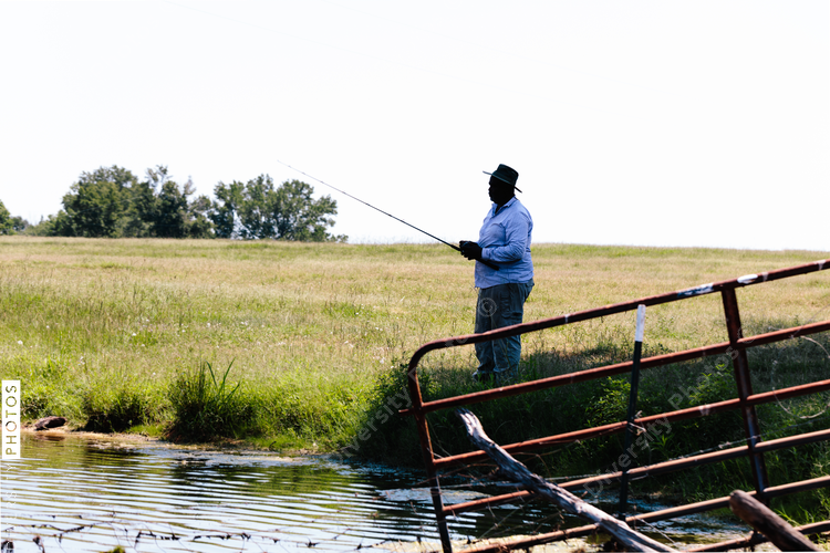 Man fishing in pond