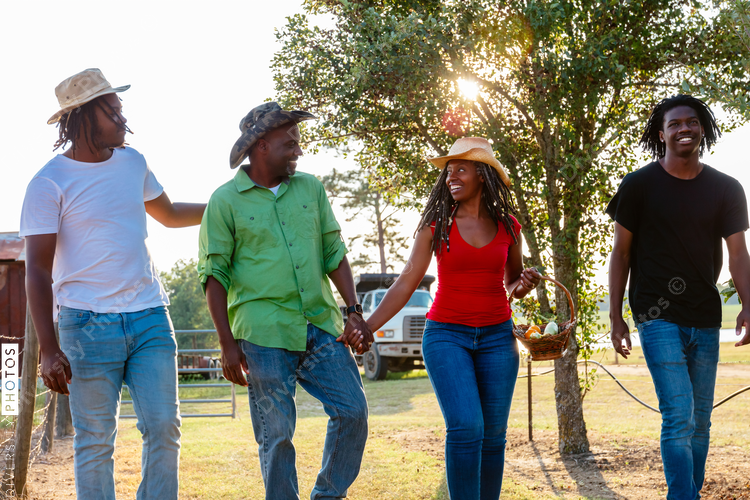Family walking and talking on farm