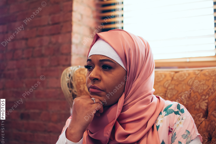Close up of thoughtful woman sitting on chair