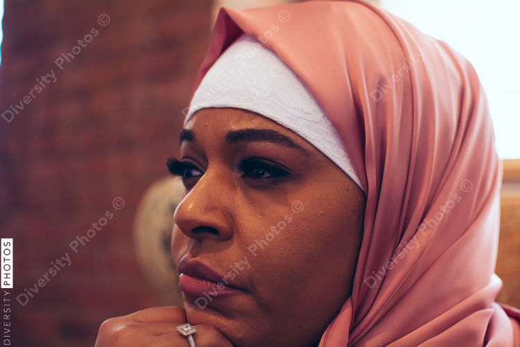 Close up of thoughtful woman sitting on chair