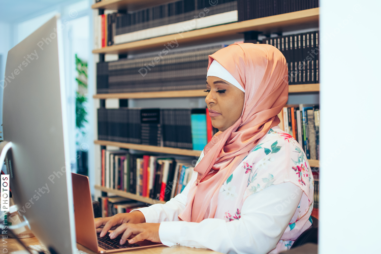 Businesswoman working on laptop in office