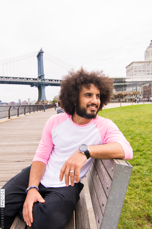 Young man sitting on the bench