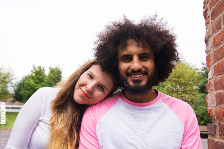 Portrait of smiling couple sitting outdoors