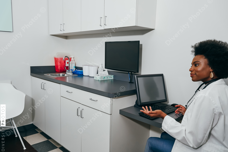 Pediatrician using computer