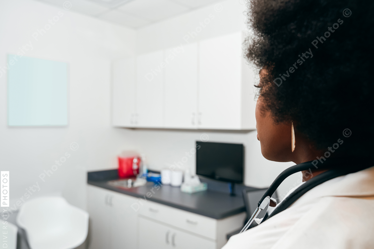 African American Pediatrician in her office