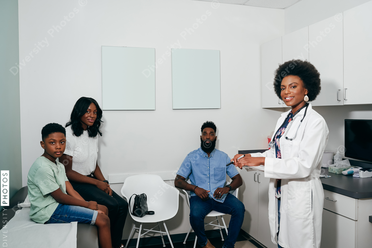 Black Pediatrician with Black patients in her office