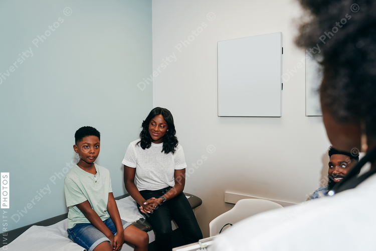 Pediatrician with patients in her office