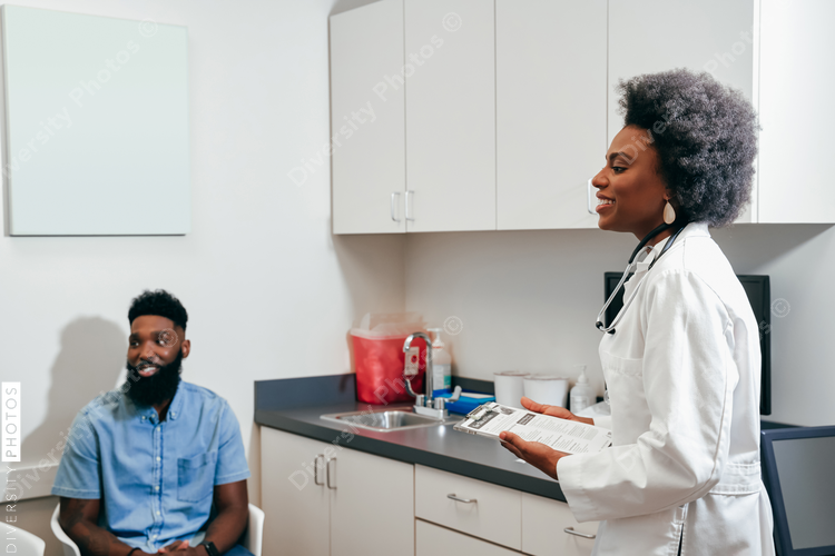 Pediatrician with client in her office