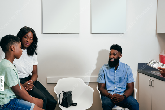 Black Family in pediatricians office