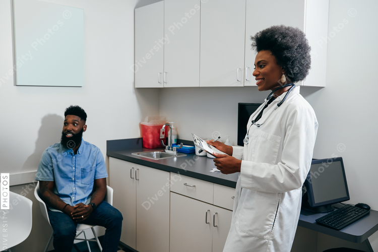 Pediatrician with client in her office