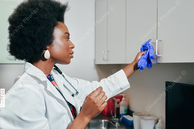 Pediatrician using rubber glove