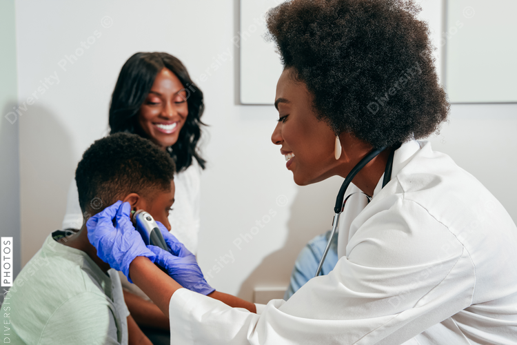 Black Pediatrician examining patient