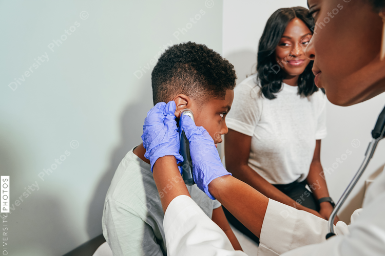 Pediatrician examining patient