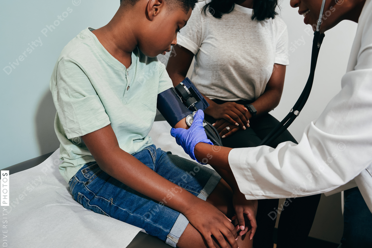 Pediatrician examining patient