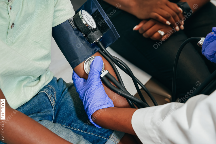 Black doctor Pediatrician examining patient
