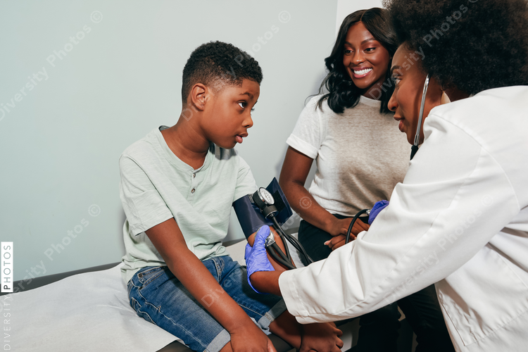 Pediatrician examining patient