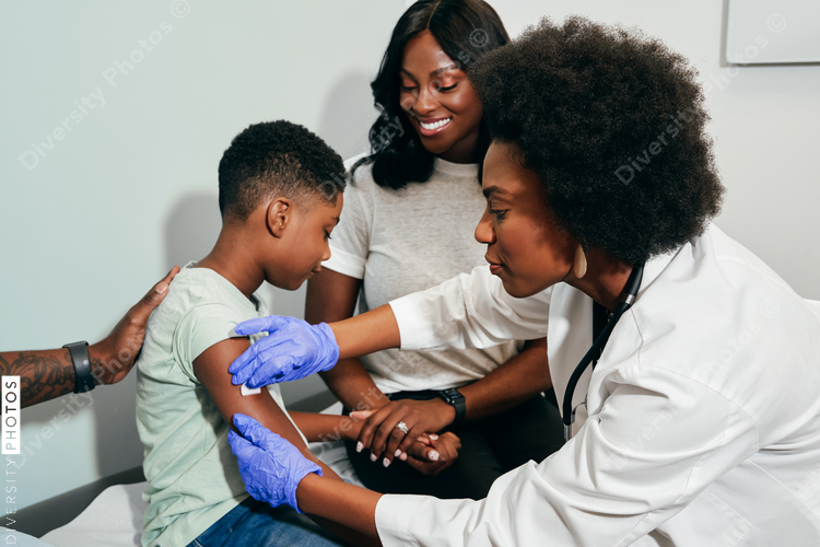 Pediatrician prepares child for vaccine shot