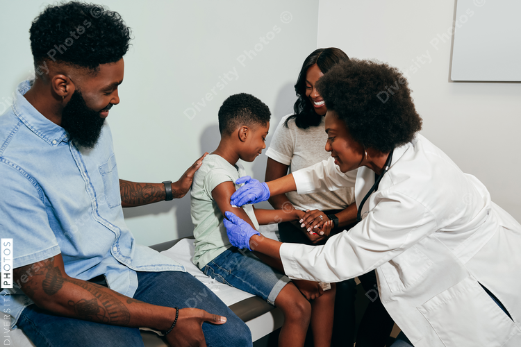 Pediatrician prepares child for vaccine shot