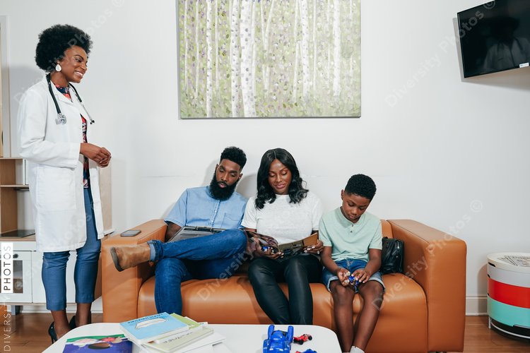 Family meeting doctor in clinic, African American 