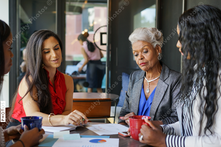 Women having a business meeting in cafe