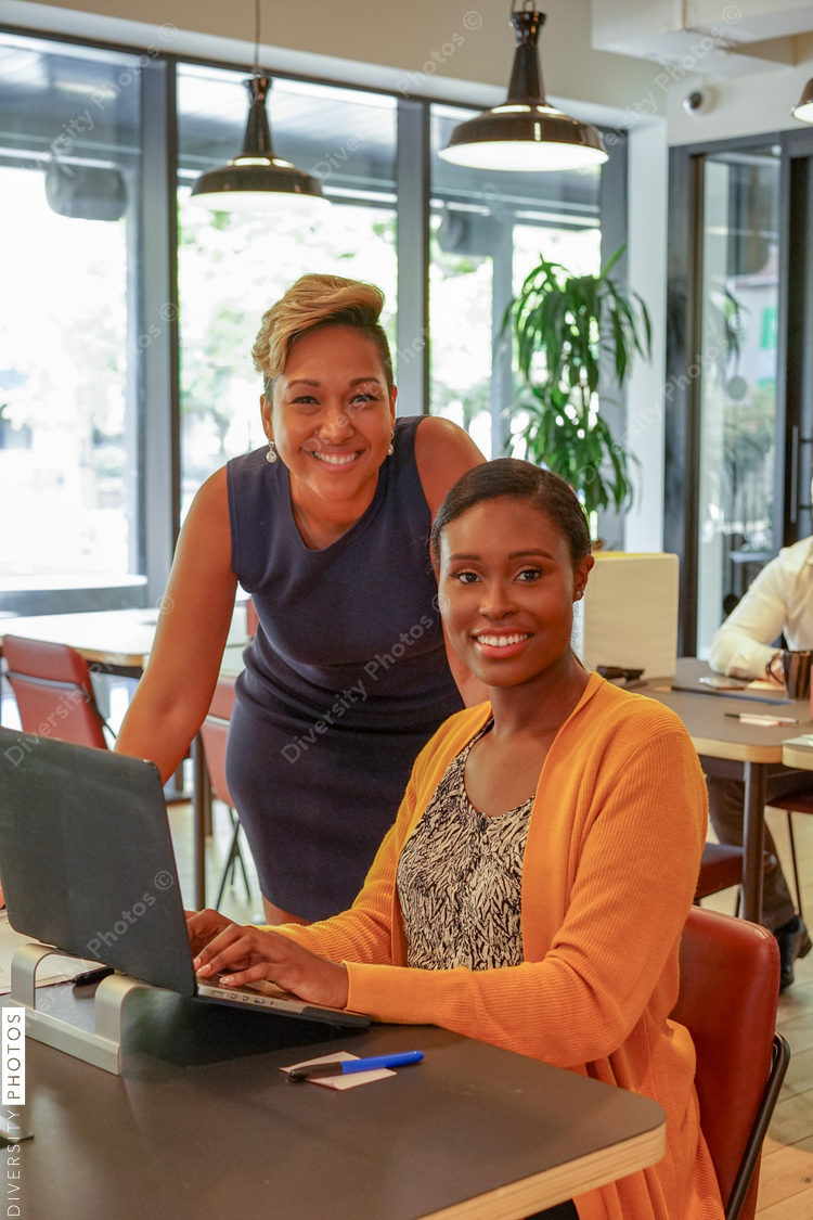 Portrait of smiling businesswomen working in office