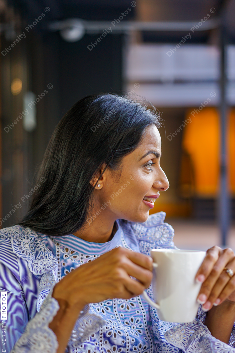 Close up of smiling woman at coffee shop