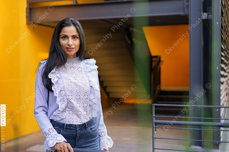 Portrait of woman standing near the railings