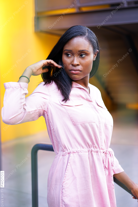 Young woman standing by the railings