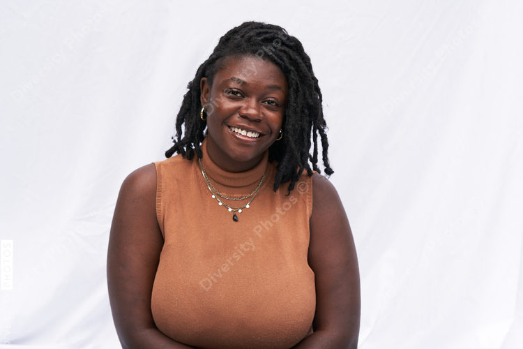 Portrait smiling plus size Black woman with locs