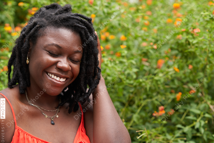 Portrait smiling plus size Black woman with locs