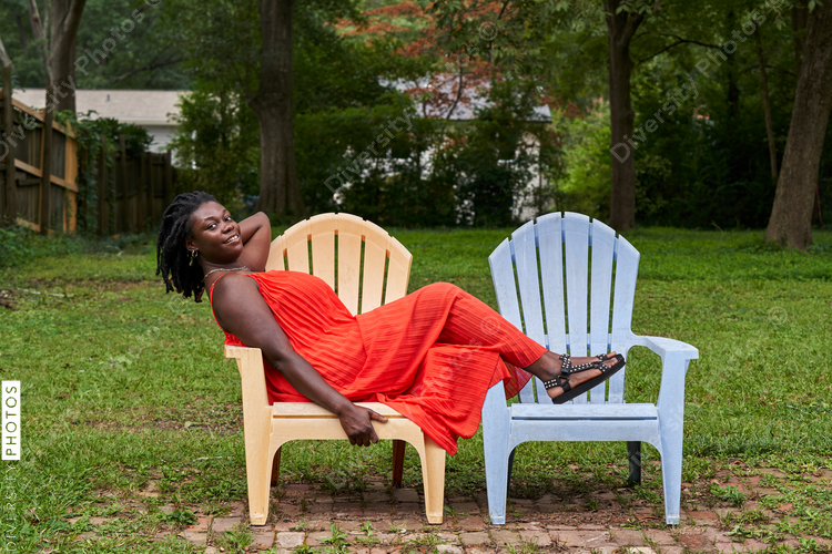 Portrait smiling plus size Black woman with locs