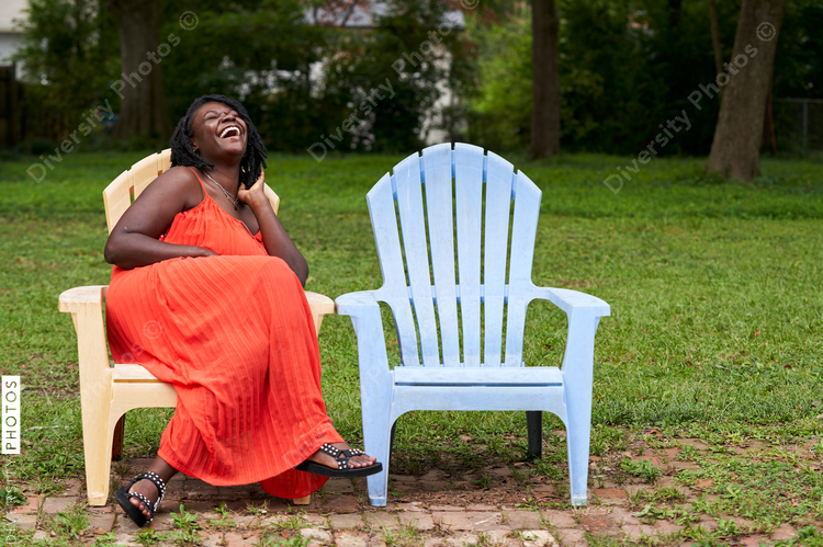 Portrait smiling plus size Black woman with locs