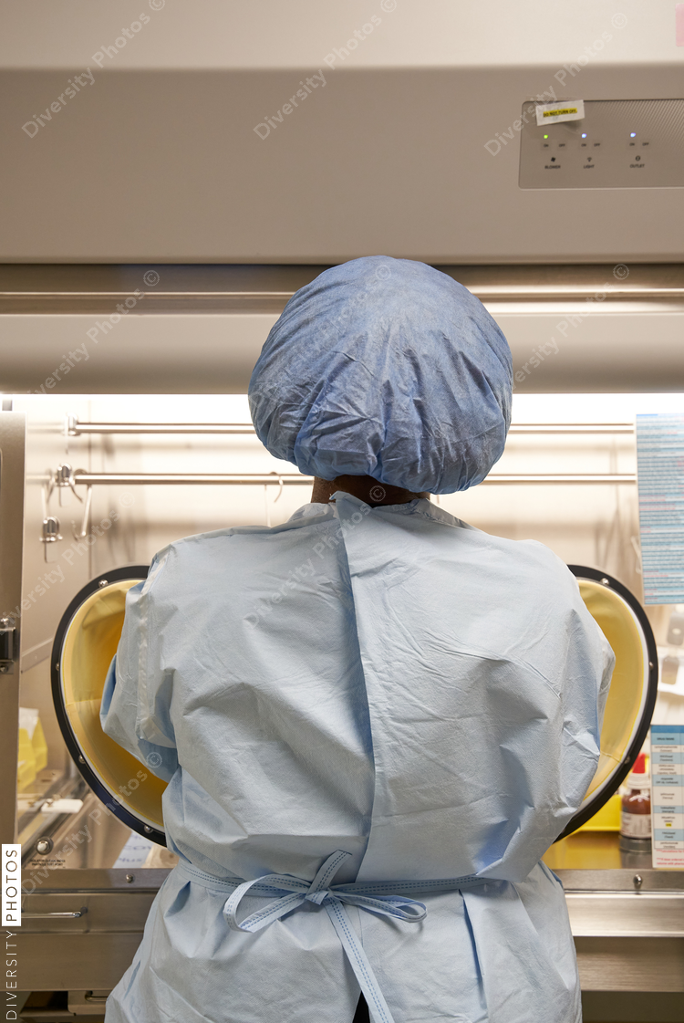 Black healthcare worker handling hazardous drugs for patient at hospital
