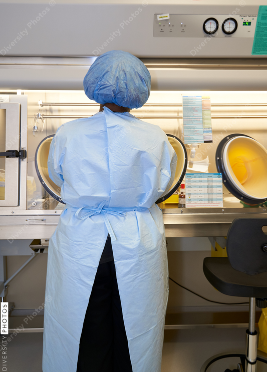 Black healthcare worker handling hazardous drugs for patient at hospital