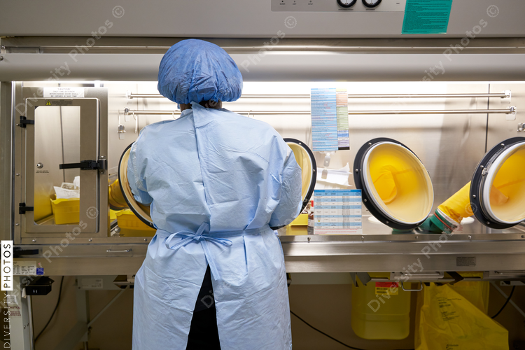 Black healthcare worker handling hazardous drugs for patient at hospital