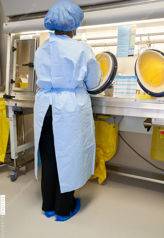 Black healthcare worker handling hazardous drugs for patient at hospital