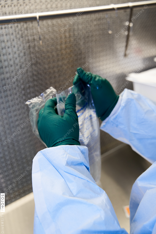 Black healthcare worker pharmacist preparing medicine