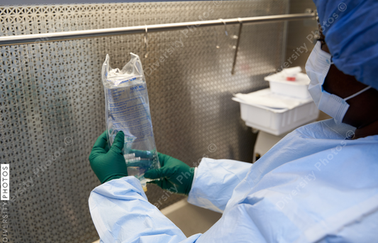 Black healthcare worker pharmacist preparing medicine