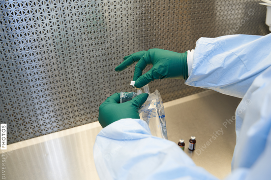 Black healthcare worker pharmacist preparing medicine