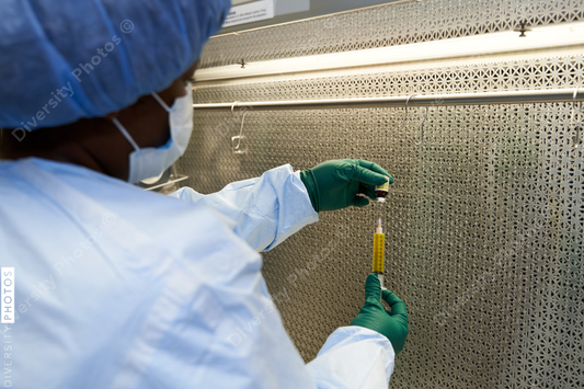 Black healthcare worker pharmacist preparing medicine