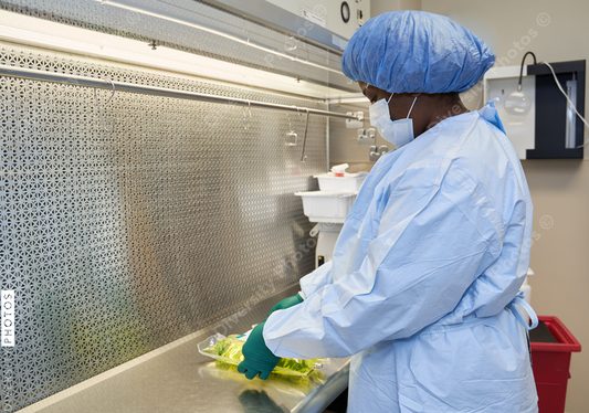 Black healthcare worker pharmacist preparing medicine