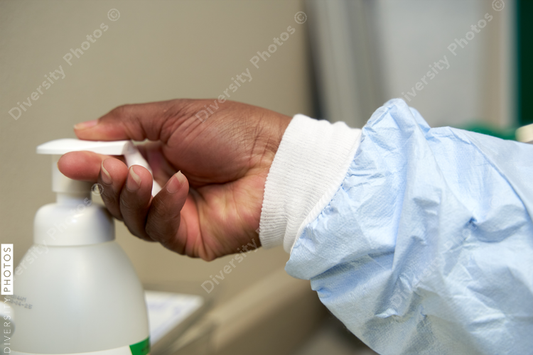Black healthcare worker washing hands