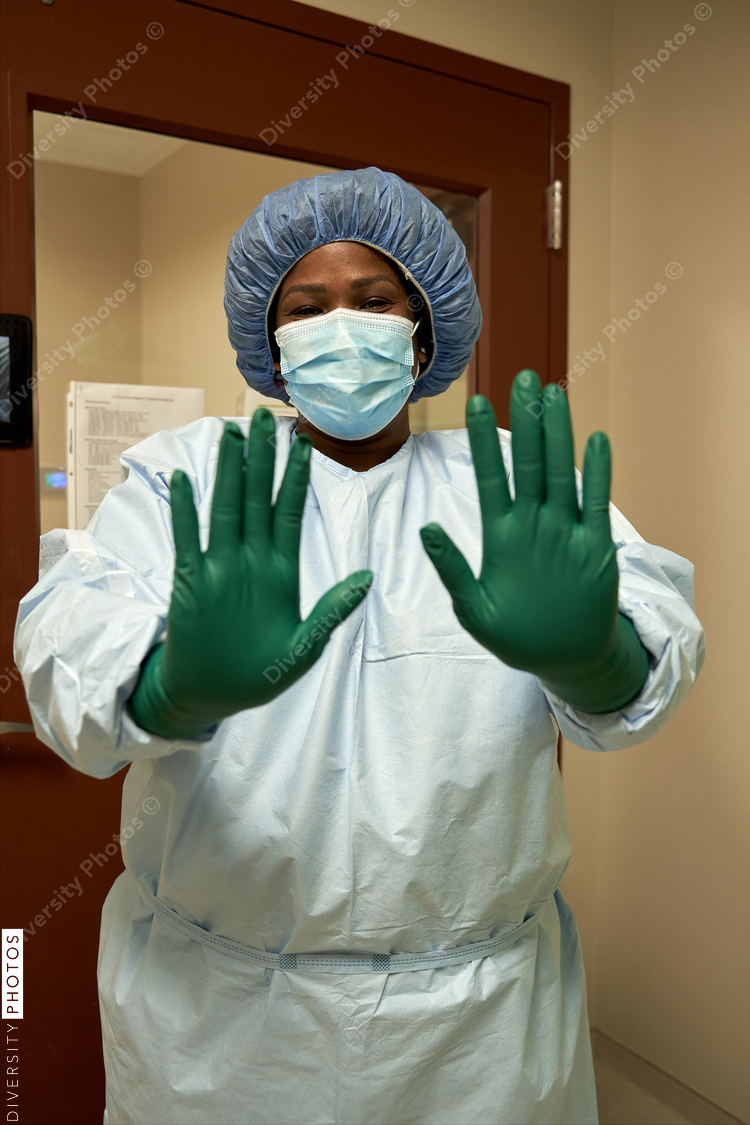 Black healthcare worker wearing PPE safety equipment