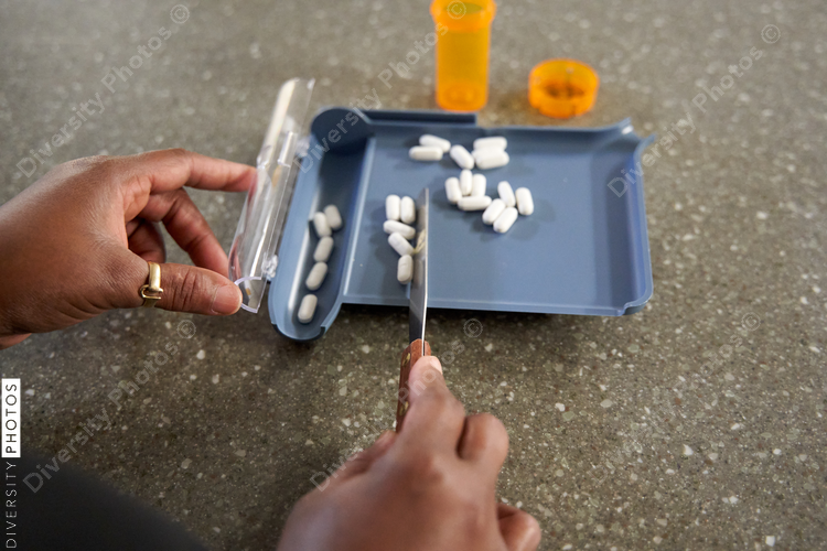 Black pharmacist prepare medication for hospital patient
